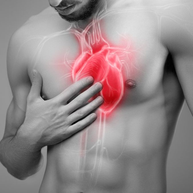 man holding heart image cardiovascular health